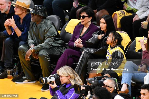 Corey Gamble, Kris Jenner, Kim Kardashian and Saint West attend a basketball game between the Los Angeles Lakers and the Memphis Grizzlies at...