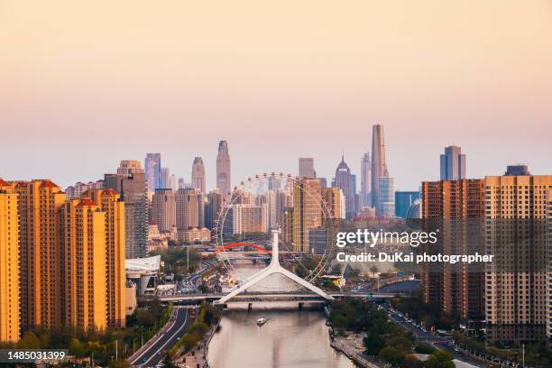 tianjin haihe ferris wheel sunset - tianjin stock pictures, royalty-free photos & images