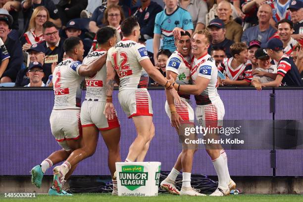 Tyrell Sloan of the Dragons celebrates with team mates after scoring a try during the round eight NRL match between Sydney Roosters and St George...