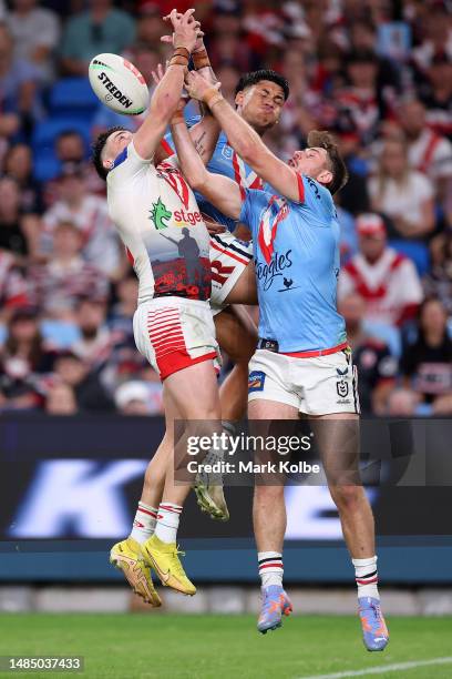 Jack Bird of the Dragons, Jaxson Paulo of the Roosters and Paul Momirovski of the Roosters compete for the ball during the round eight NRL match...