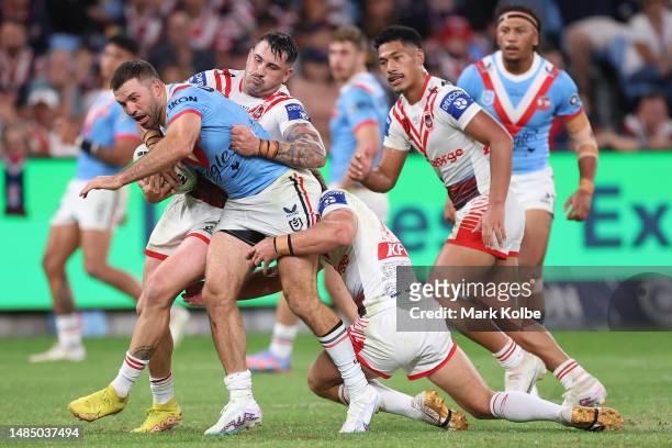 James Tedesco of the Roosters is tackled during the round eight NRL match between Sydney Roosters and St George Illawarra Dragons at Allianz Stadium...