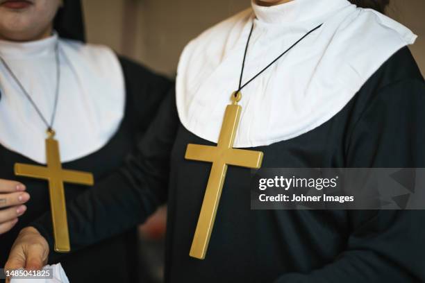 two women dressed as nuns for halloween - madre imagens e fotografias de stock