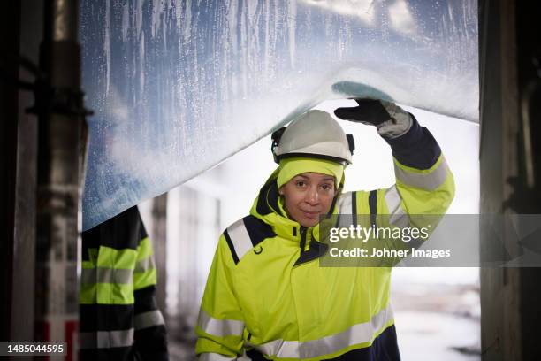 portrait of female engineer at construction site - construction worker pose stock pictures, royalty-free photos & images