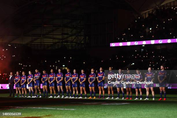 The Storm look on during the ANZAC Day ceremony prior to the round eight NRL match between Melbourne Storm and New Zealand Warriors at AAMI Park on...