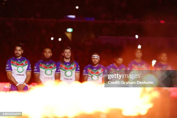 The Warriors look on during the ANZAC Day ceremony prior to the round eight NRL match between Melbourne Storm and New Zealand Warriors at AAMI Park...