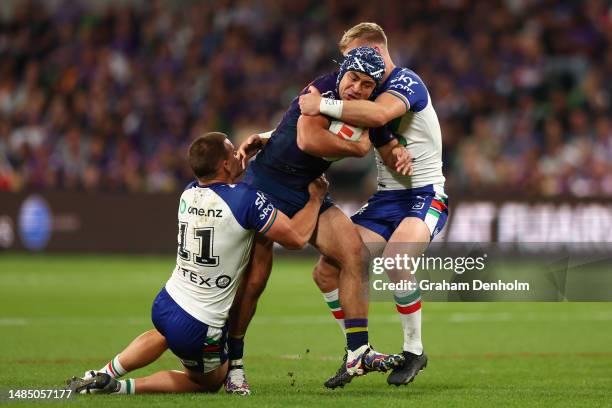 Jahrome Hughes of the Storm is tackled during the round eight NRL match between Melbourne Storm and New Zealand Warriors at AAMI Park on April 25,...