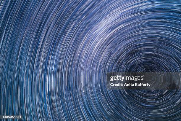 stars in the night - star trail stock pictures, royalty-free photos & images