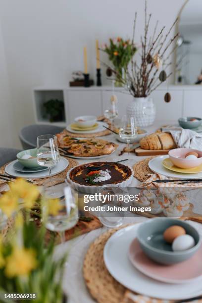 table set for easter meal - easter feast stock pictures, royalty-free photos & images