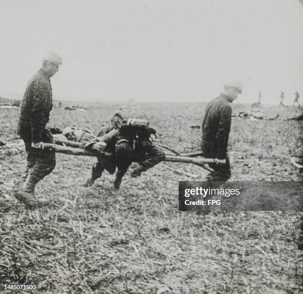 French Army stretcher bearers carry a wounded soldier off the field during an engagement along the Marne front in France circa September 1914.