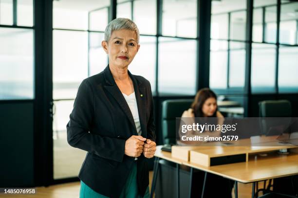 mature and fabulous: a stylish asian woman in her element - white tie stock pictures, royalty-free photos & images