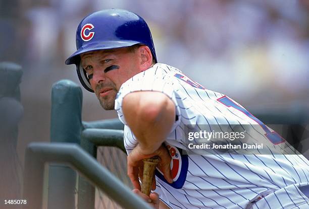 Mark Grace of the Chicago Cubs stretches over his bat during the game against the Chicago White Sox at Wrigley Field in Chicago, Illinois. The Cubs...