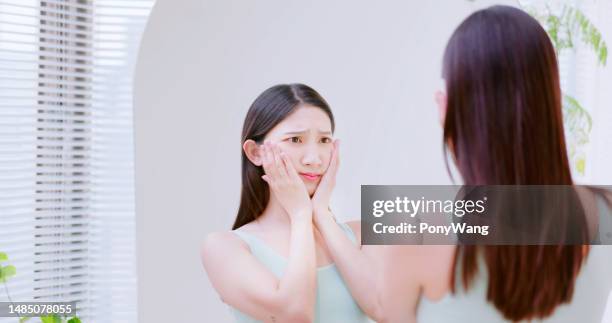 girl looking her face - pore stock pictures, royalty-free photos & images