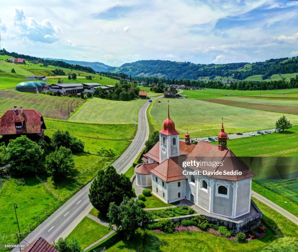 Aerial view of St. Jost Church nestled in the Lucerne countryside