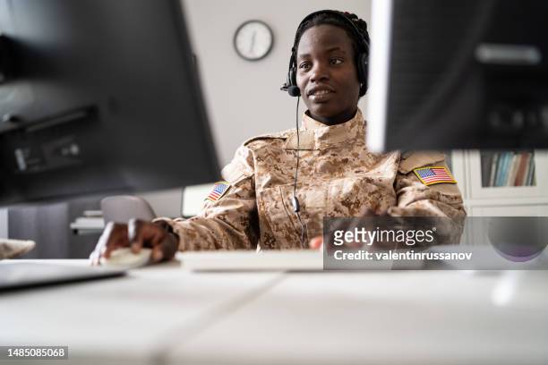 woman soldier working at military office - military computer stock pictures, royalty-free photos & images
