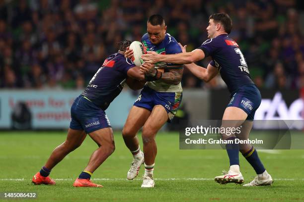 Marata Niukore of the Warriors is tackled during the round eight NRL match between Melbourne Storm and New Zealand Warriors at AAMI Park on April 25,...