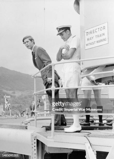 Prince Charles onboard HMS Charybdis, a Leander-class frigate of the Royal Navy following Fiji's Independence Day visit in October 1970. He leans...