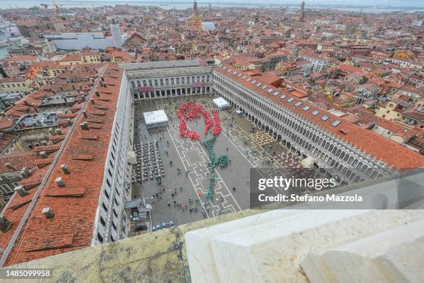 General view from St. Mark's Campanile as people gather to form the shape of a giant rosebud on April 25, 2023 in Venice, Italy. Hundreds of...