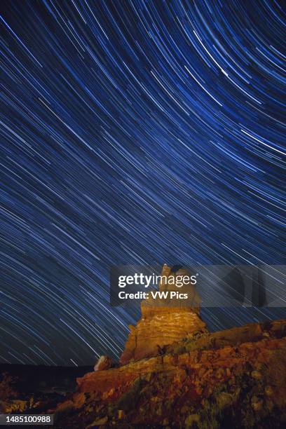 Star trails over a rock formation in Arches National Park, near Moab, Utah.