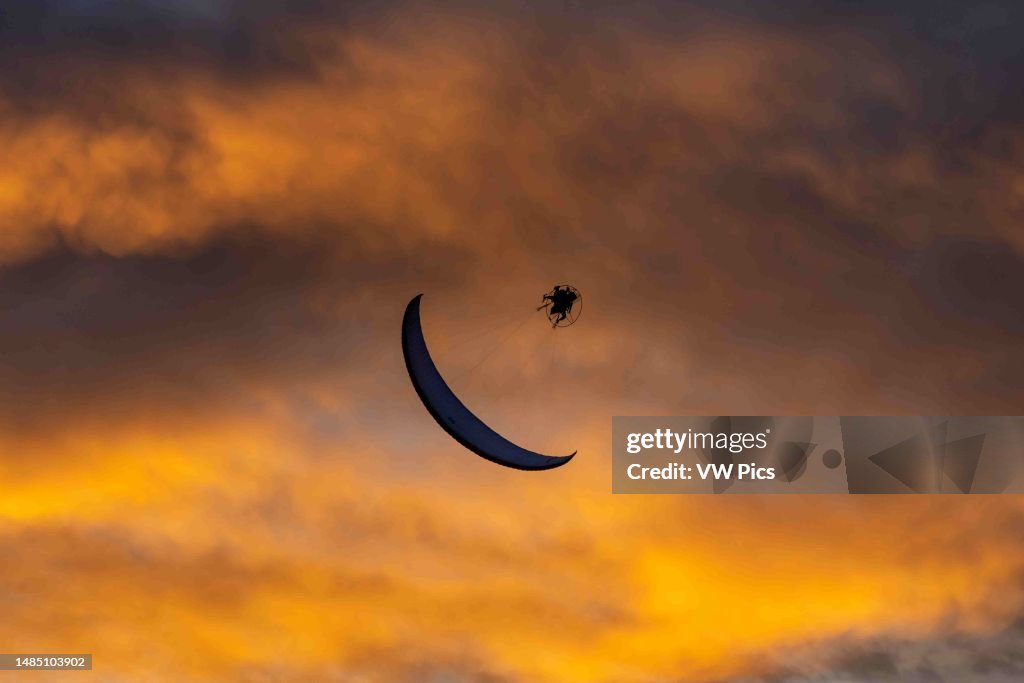 Loop Acrobatic A powered paraglider performs an aerobatic loop while flying at... News ...