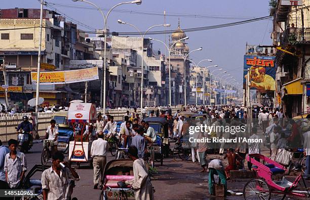 a typical crowd scene in busy chandni chowk. - national capital territory of delhi stock pictures, royalty-free photos & images