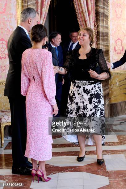 King Felipe VI of Spain and Queen Letizia of Spain greet Spanish author Megan Maxwell before a luncheon for world literature members on the occasion...