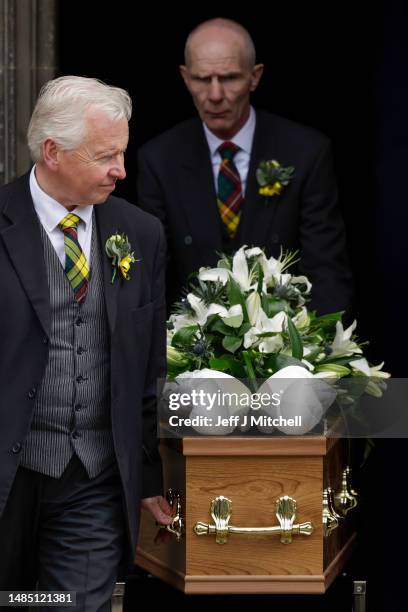 White boxing gloves lie on the coffin as it carried into a hearse to leave the funeral ceremony of Ken Buchanan at St Giles’ Cathedral on April 25,...