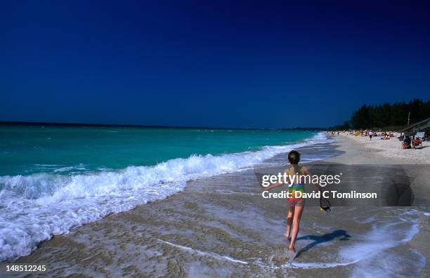 girl running along turtle beach, siesta key. - sarasota stock pictures, royalty-free photos & images