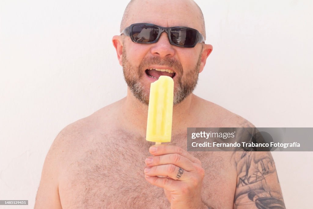 Man eats lemon ice cream