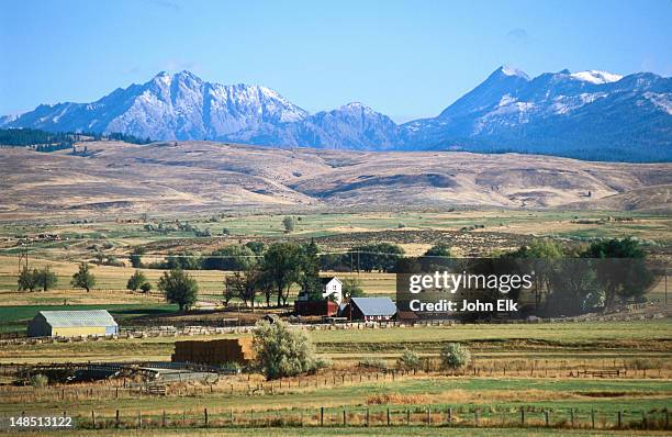 farm and wallowa mountains, powder river valley. - oregon stock pictures, royalty-free photos & images