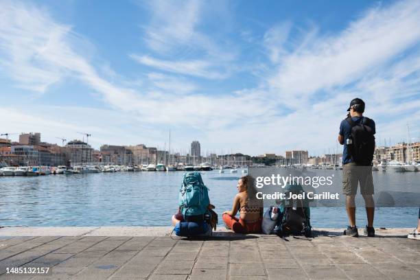 travelers at the old port of marseille - marseille people stock pictures, royalty-free photos & images