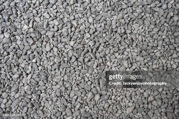 abstract dry pebbles stones gray toned background - gravidas imagens e fotografias de stock