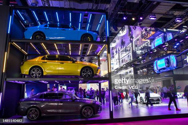 People visit the Lynk & Co Auto booth during the 20th Shanghai International Automobile Industry Exhibition at the National Exhibition and Convention...