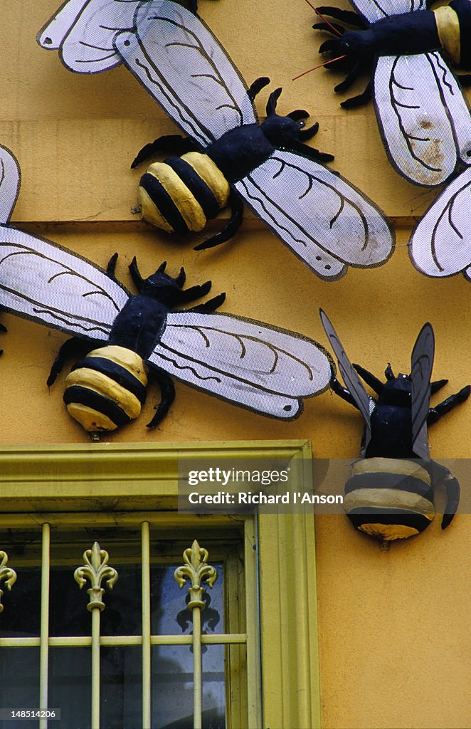 Huge bees rest on a shop facade on Melbourne's Brunswick Street.