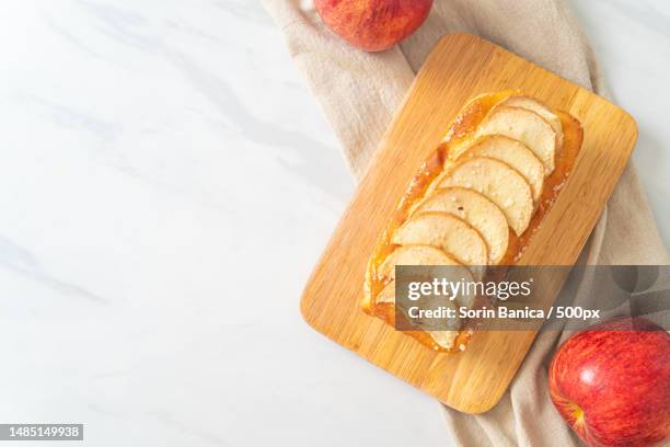 apple loaf crumbled on wood board - caramel block stock pictures, royalty-free photos & images