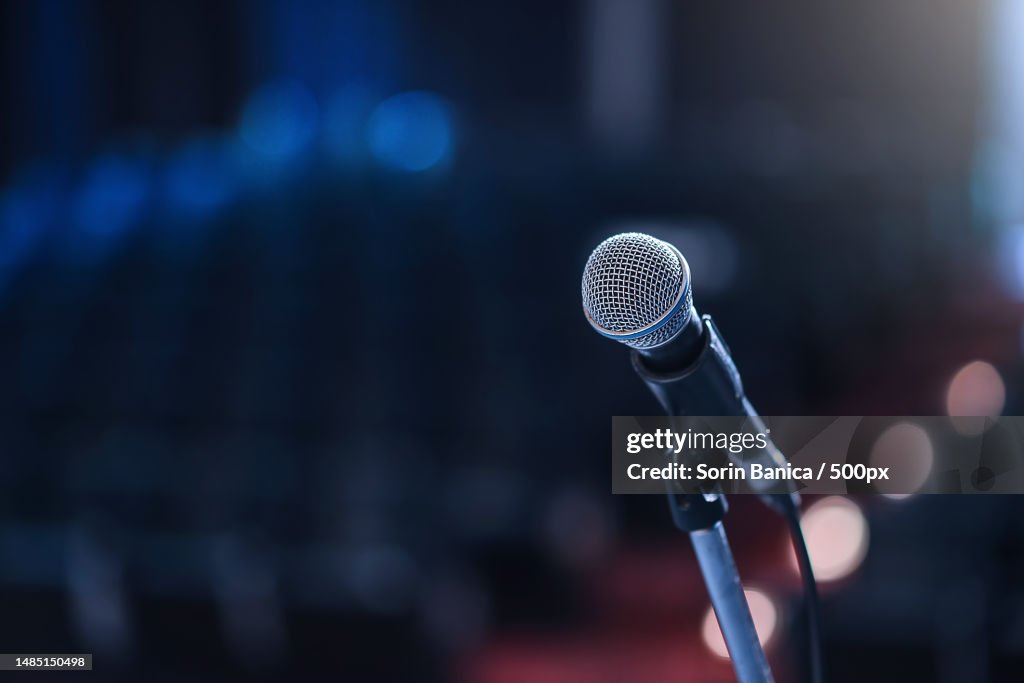 Close up of microphone in concert hall or conference room