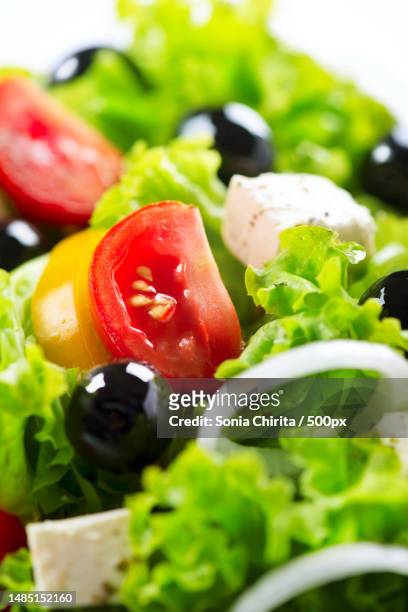 greek salad closeup with feta cheese,tomatoes and olives,romania - spicule stock pictures, royalty-free photos & images