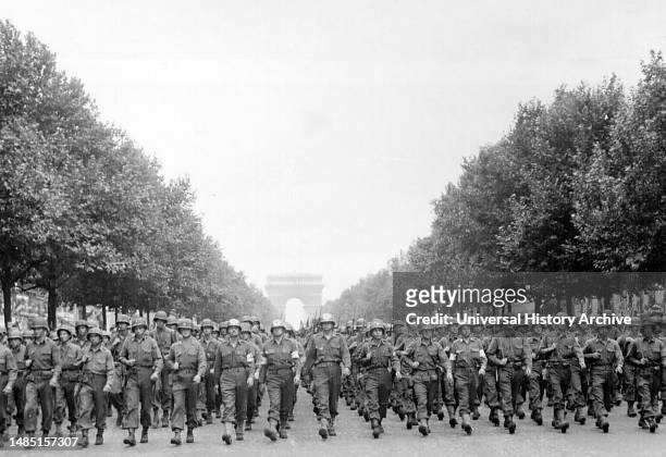American troops of the 28th Infantry Division march down the Avenue des Champs-Elysees, Paris, in the `Victory' Parade following the Liberation of...