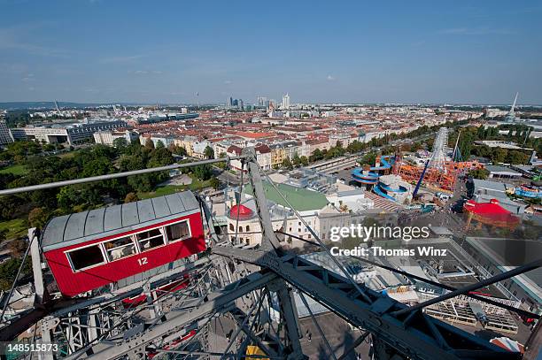 view towards uno city from ferris wheel at prater amusement park. - prater wien stock-fotos und bilder