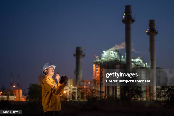 engineer working at gas turbine electrical power plant - gas turbine electrical power plant stock pictures, royalty-free photos & images