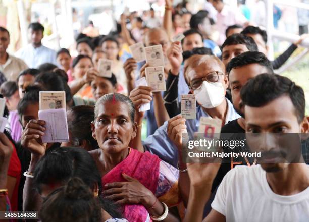 Election staff members with an electronic voting machine during the counting of votes of the Tripura Assembly By-Election, at a counting centre in...