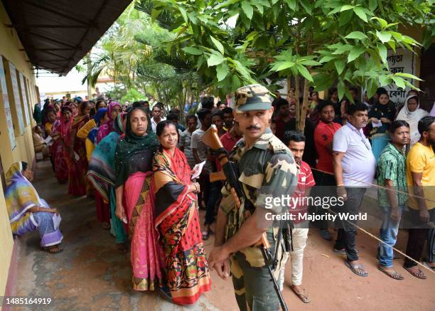 Election staff members with an electronic voting machine during the counting of votes of the Tripura Assembly By-Election, at a counting centre in...