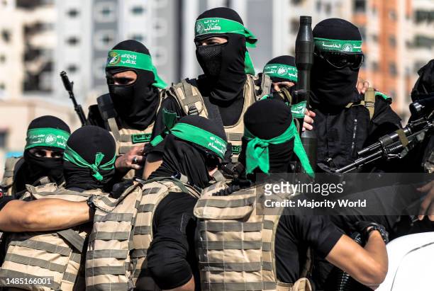 Gunmen from the Izz al-Din al-Qassam Brigades, the military wing of Hamas, during an anti-Israel military march in Gaza City, Gaza Strip. Palestine.