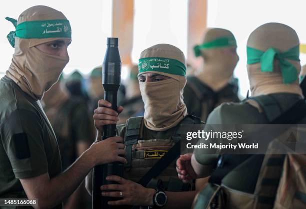 Gunmen from the Izz al-Din al-Qassam Brigades, the military wing of Hamas, during an anti-Israel military march in Gaza City, Gaza Strip. Palestine.