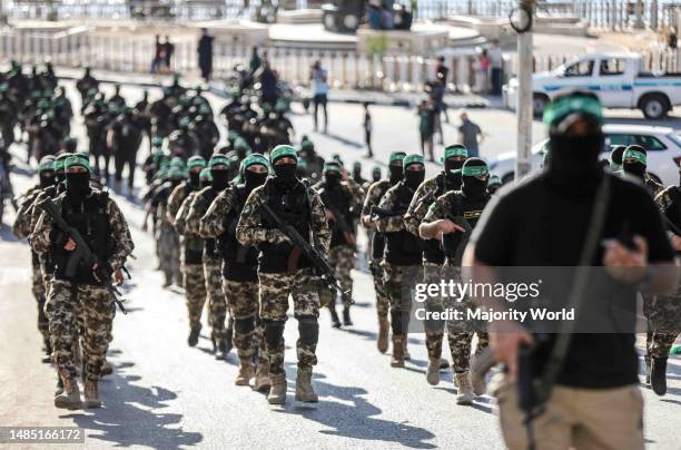 Gunmen from the Izz al-Din al-Qassam Brigades, the military wing of Hamas, during an anti-Israel military march in Gaza City, Gaza Strip. Palestine.