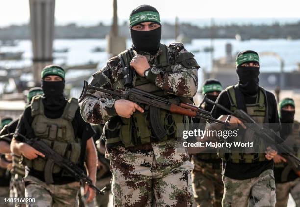 Gunmen from the Izz al-Din al-Qassam Brigades, the military wing of Hamas, during an anti-Israel military march in Gaza City, Gaza Strip. Palestine.