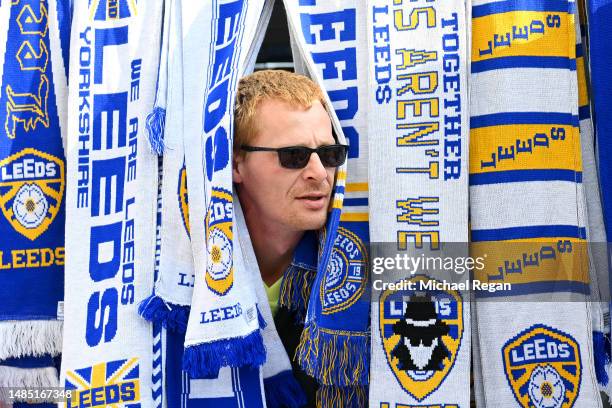 Leeds United merchandise seller looks on prior to the Premier League match between Leeds United and Leicester City at Elland Road on April 25, 2023...