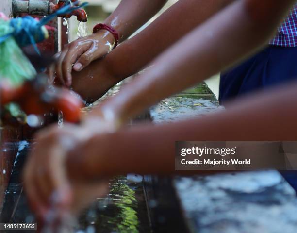 Students of Vivekananda High School are washing their hands before taking their meals on Global Hand washing Day on 15th October at Agartala. Global...