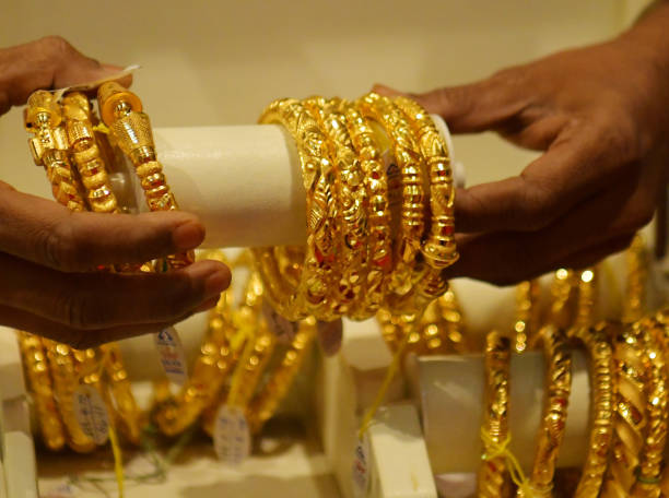 People buy jewellery on the occasion of Dhanteras ahead of the Hindu festival of Diwali at a jewellery store in Agartala. Dhanteras, which occurs two...