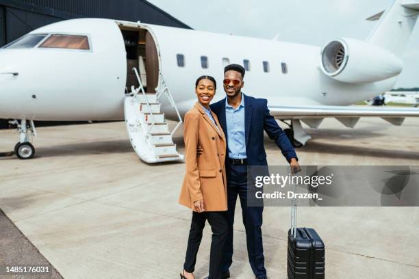 passengers in private luxury jet - private wealth stock pictures, royalty-free photos & images