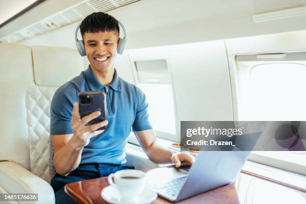 chinese entrepreneur flying by private luxury jet - business class stock pictures, royalty-free photos & images